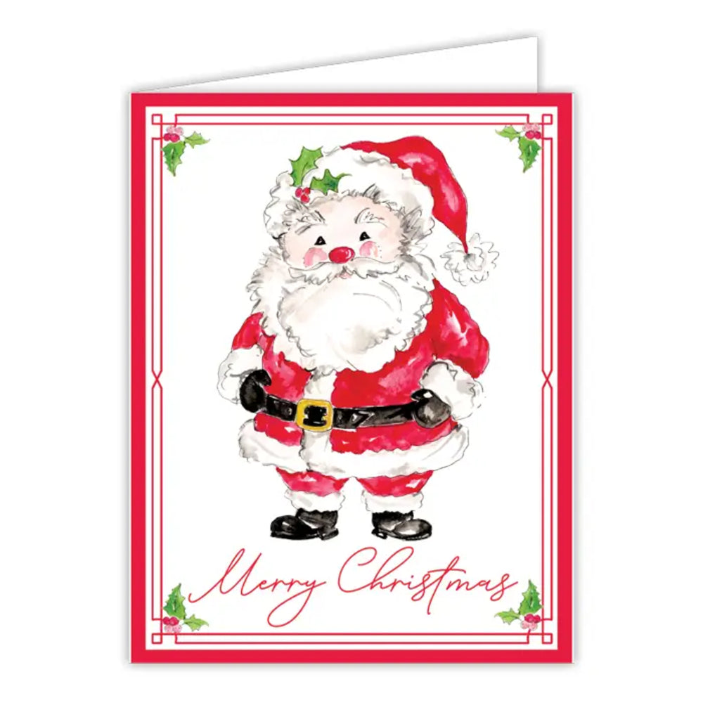 A Christmas greeting card featuring a watercolor-style illustration of Santa Claus in a red suit with white trim, black belt and boots, and green holly accents. The card has a red border, the words 'Merry Christmas' in red script at the bottom, and a folded white card backing visible behind the front.