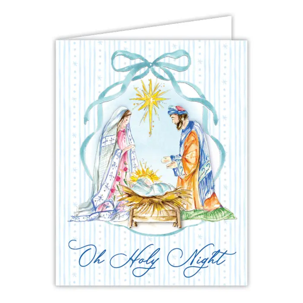A greeting card featuring a watercolor-style illustration of the Holy Family in a nativity scene, with a blue bow at the top and the text 'Oh Holy Night' in blue script at the bottom. The card has a white background with light blue vertical stripes.