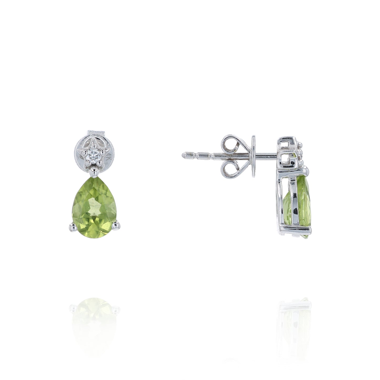 Pair of white gold earrings with pear shape peridot and diamond accents on a white background