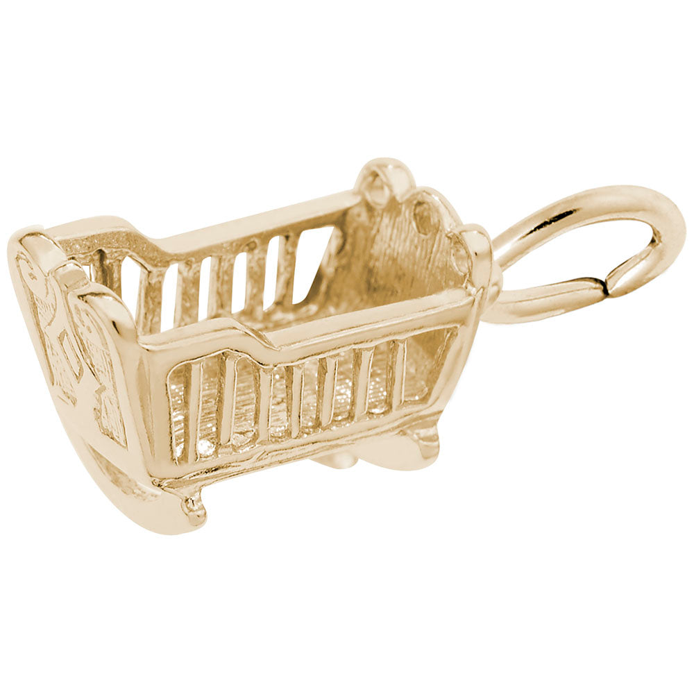Gold cradle charm on a white background