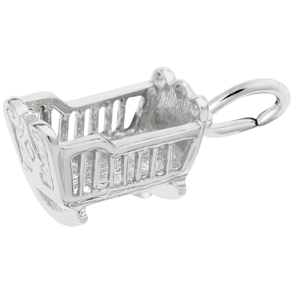 Silver cradle charm on a white background