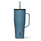 A blue Grey Corkcicle Cold Cup XL with a flat handle and a silicone straw tab, triple insulated and cup holder friendly.