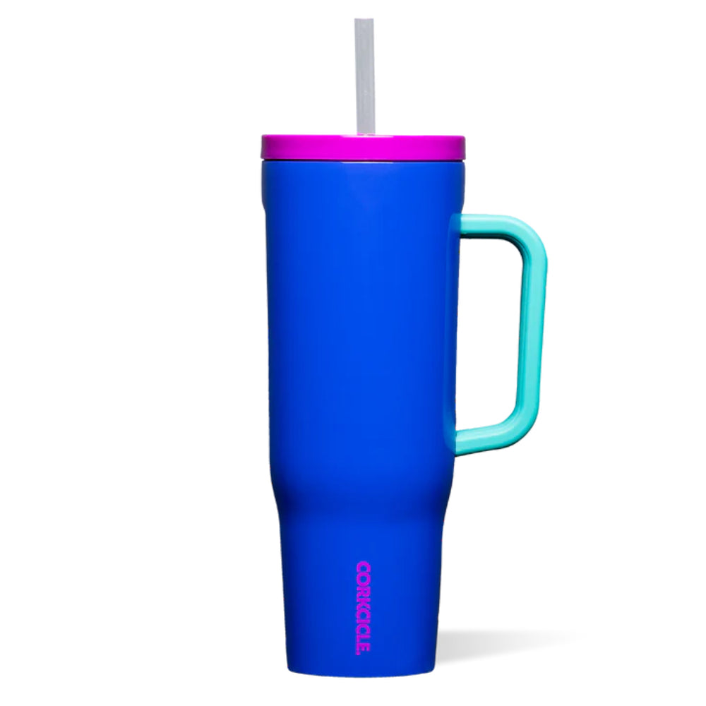 Blue tumbler with teal handle and silver straw and pink lid on a white backround.