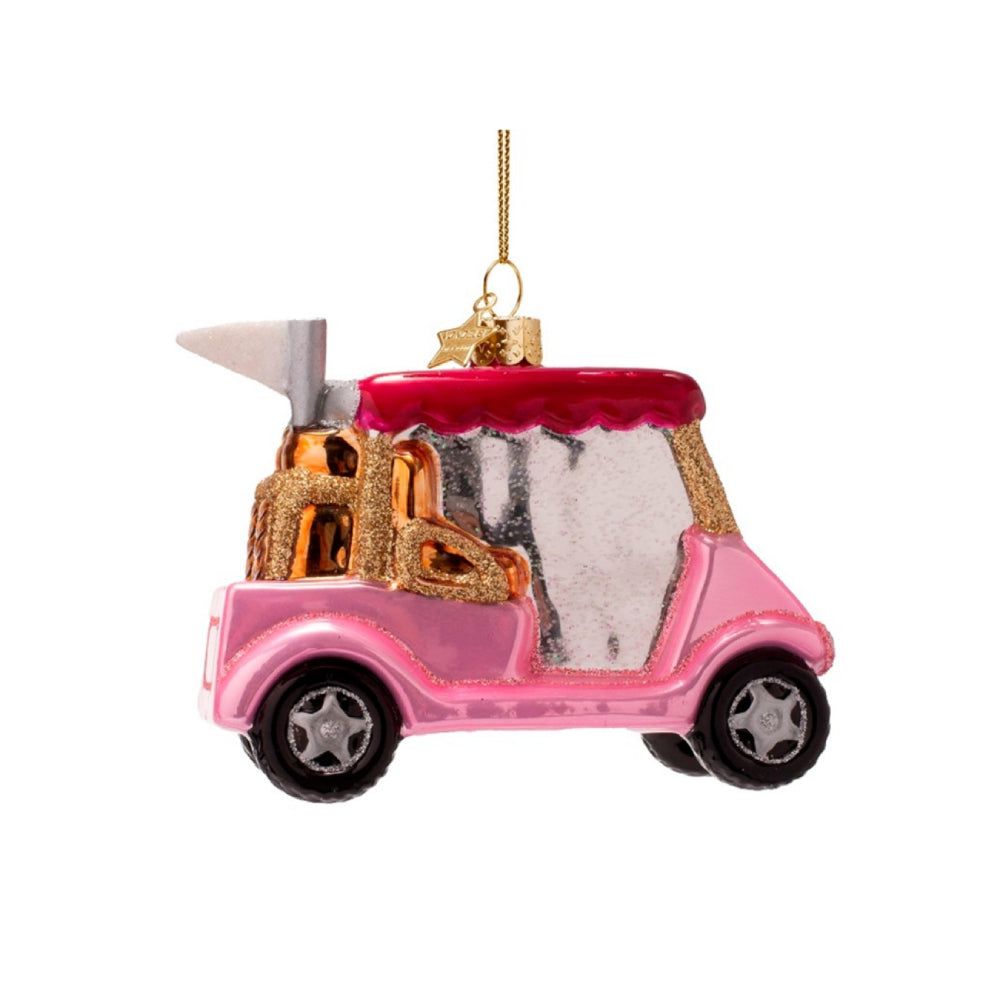 Pink golf cart ornament with a shovel and bag of sand on a white background