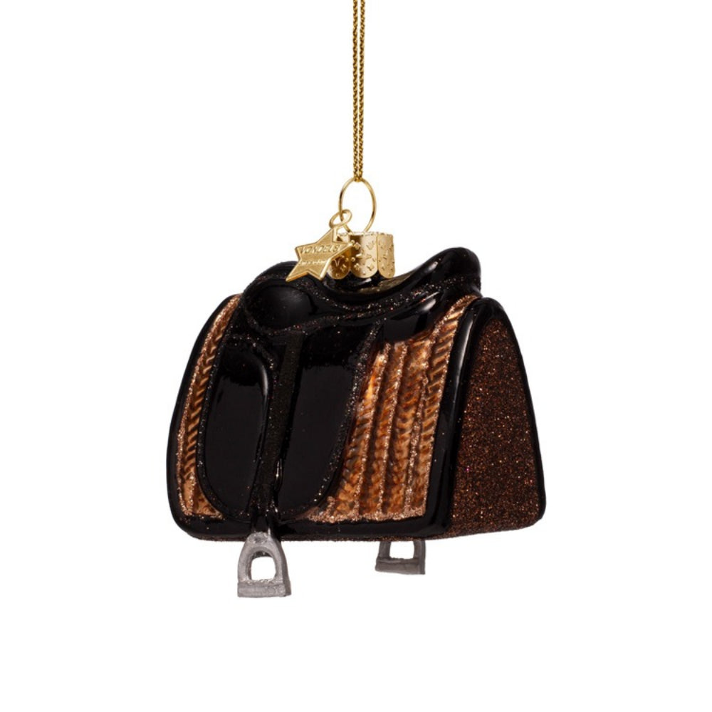Glass ornament shaped like a horse saddle on a white background