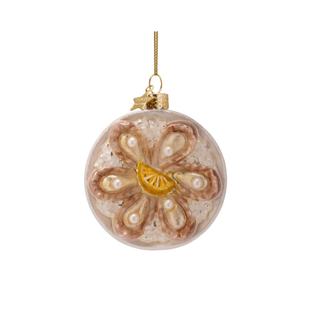 Decorative glass ball with oyster design on a white background
