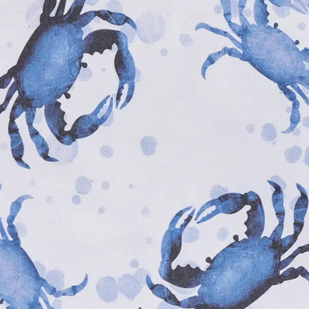 Close up of blue crab napkin with blue crab designs on white background. 