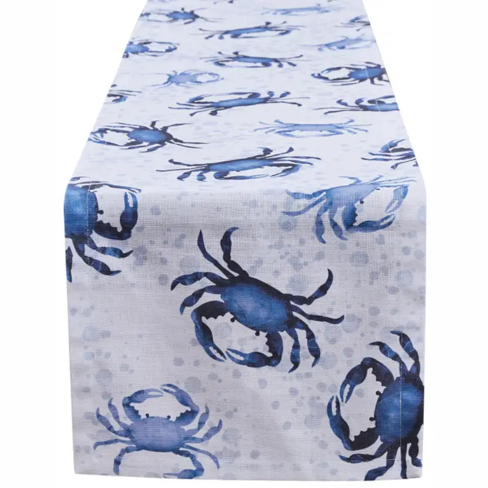 Table runner with blue crabs on white background.
