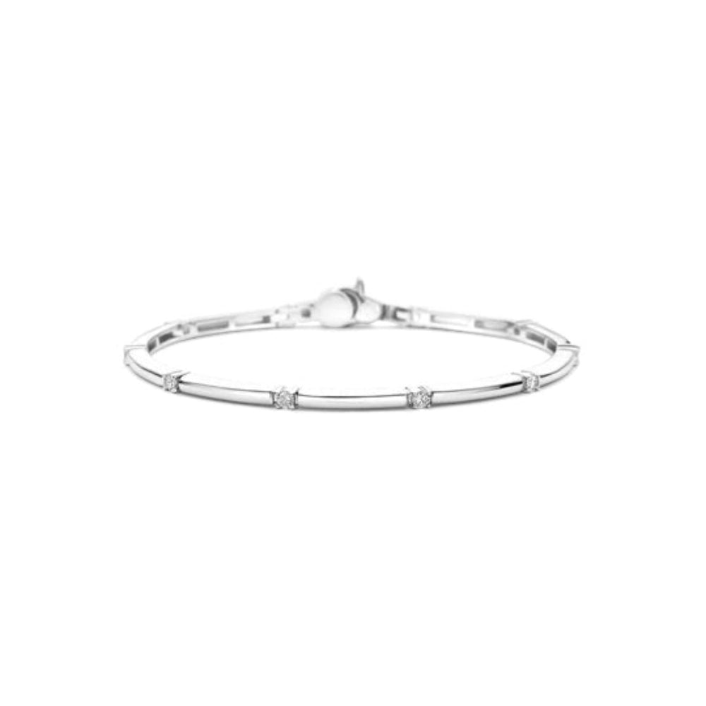 A silver bangle bracelet with a polished rectangular tubular enter band and small clear gemstone accents at intervals, 