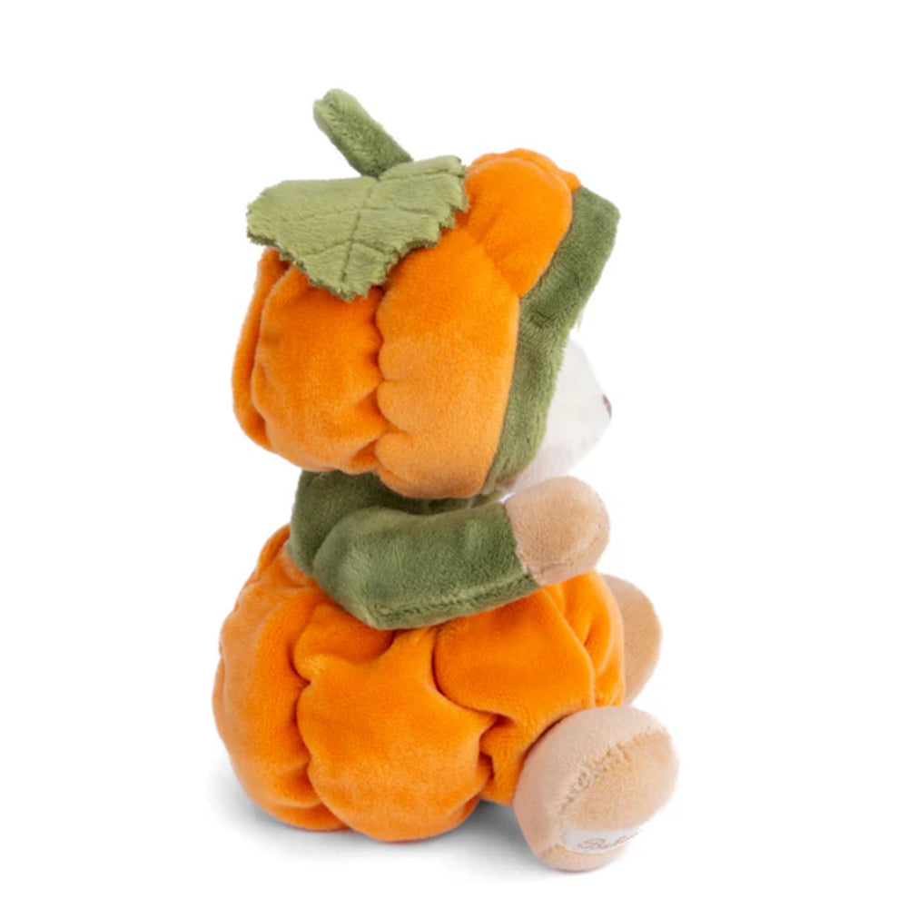 A side photo of a white teddy bear in an orange & green  pumpkin costume on a white background.