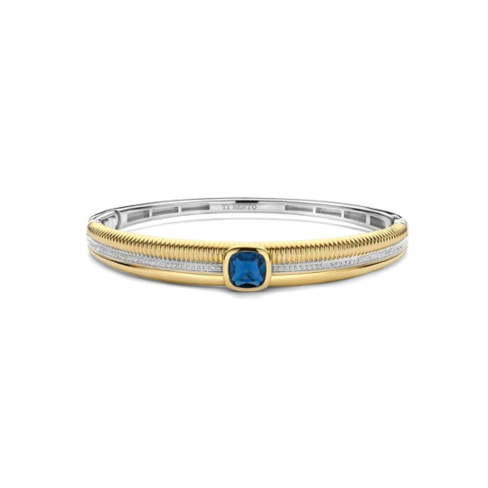 Gold plated and silver bangle with blue stone 