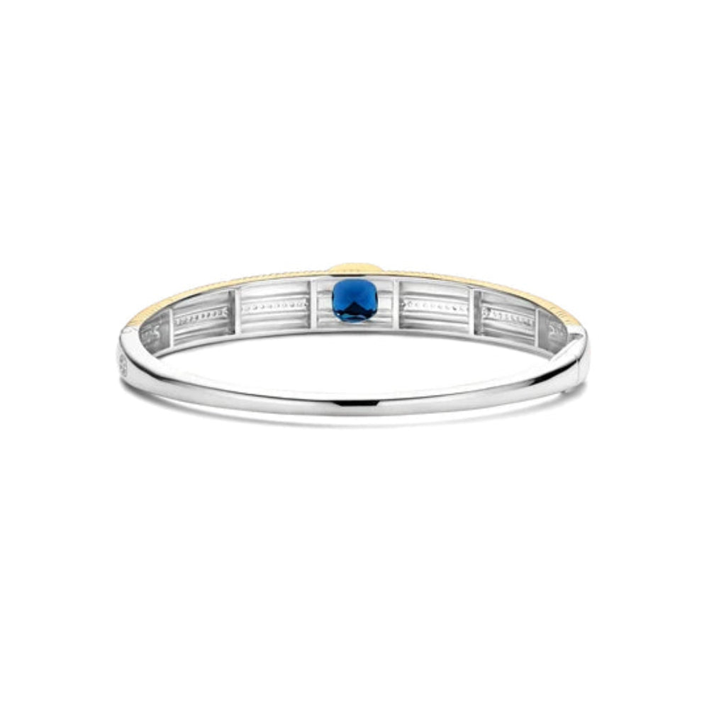 two tone bangle bracelet with blue stone 