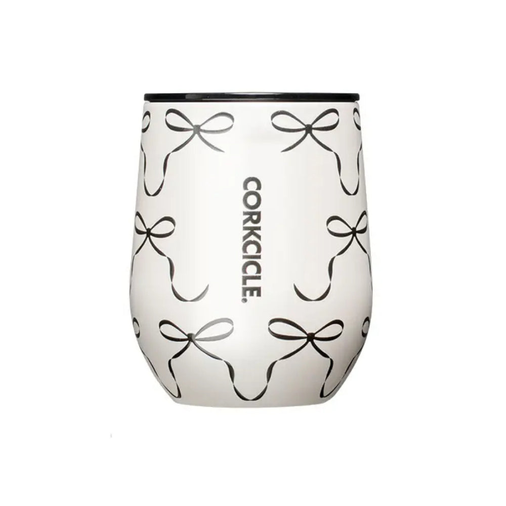 White wine tumbler with black bow pattern and Corkcicle logo in black on a white background.