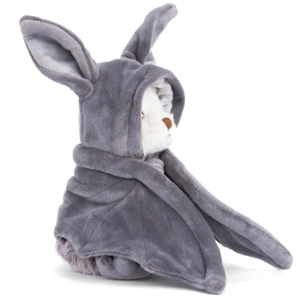 a side photo of a white teddy bear in a gray hood bat outfit with wings on a white background.