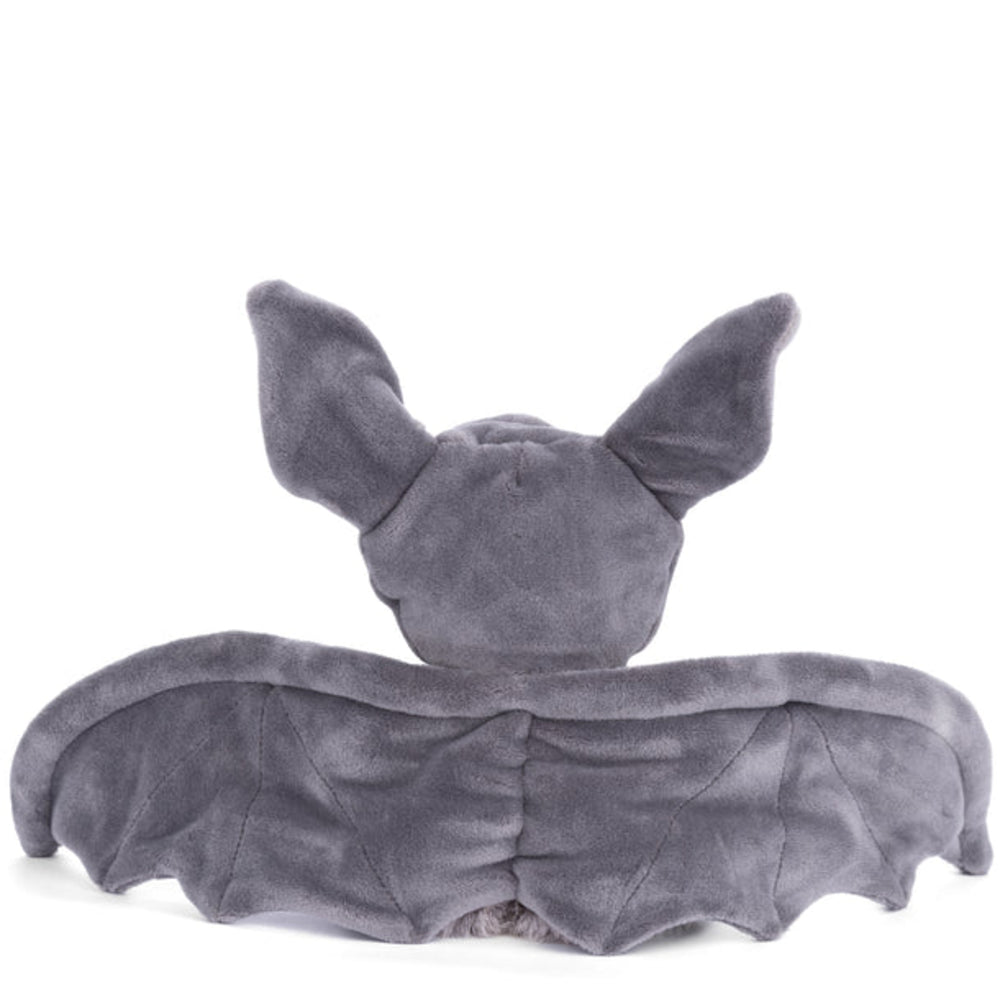 a photo of the back of a white teddy bear in a gray hood bat outfit with wings extened on a white background.