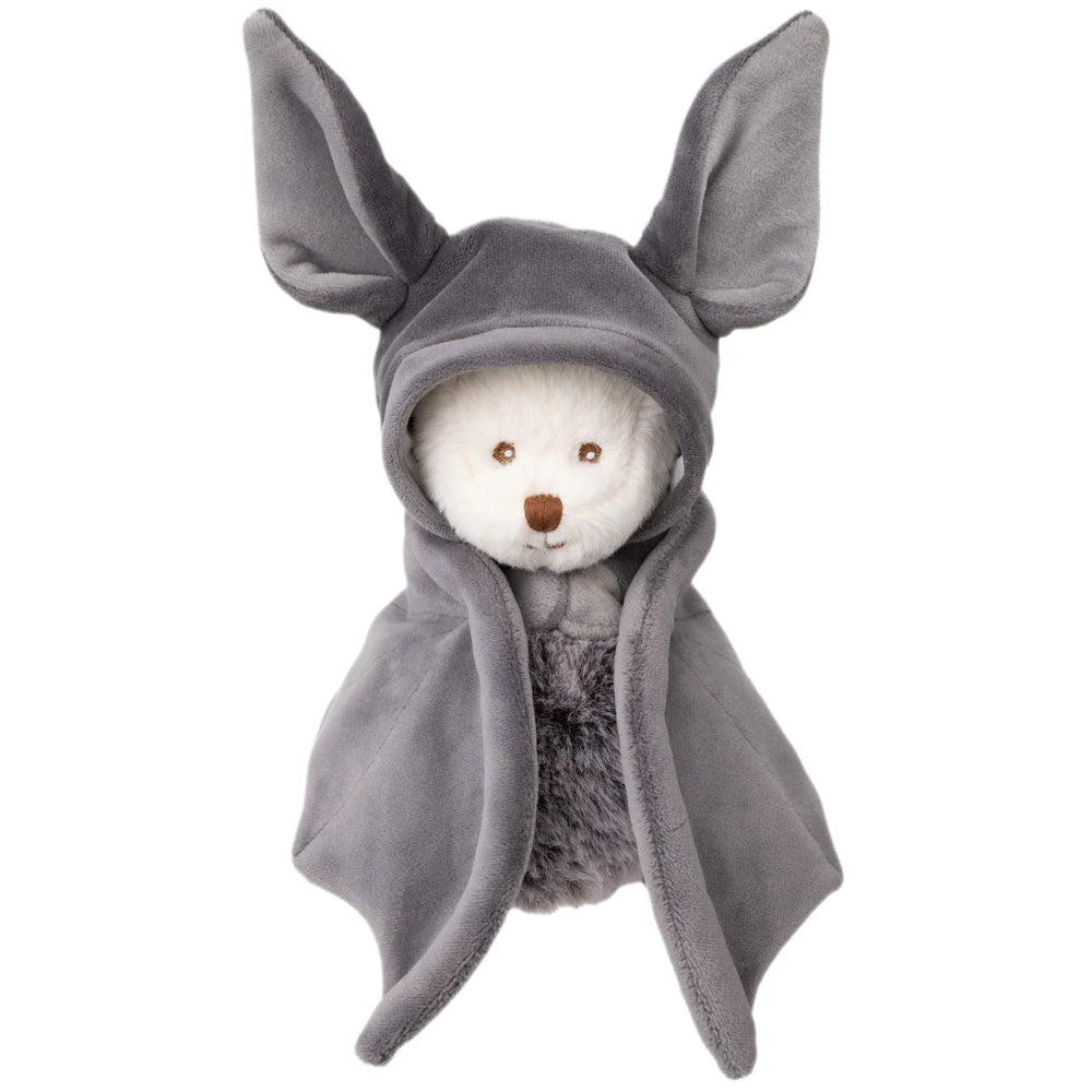 White teddy bear in a gray hooded bat outfit with wings on a white background.