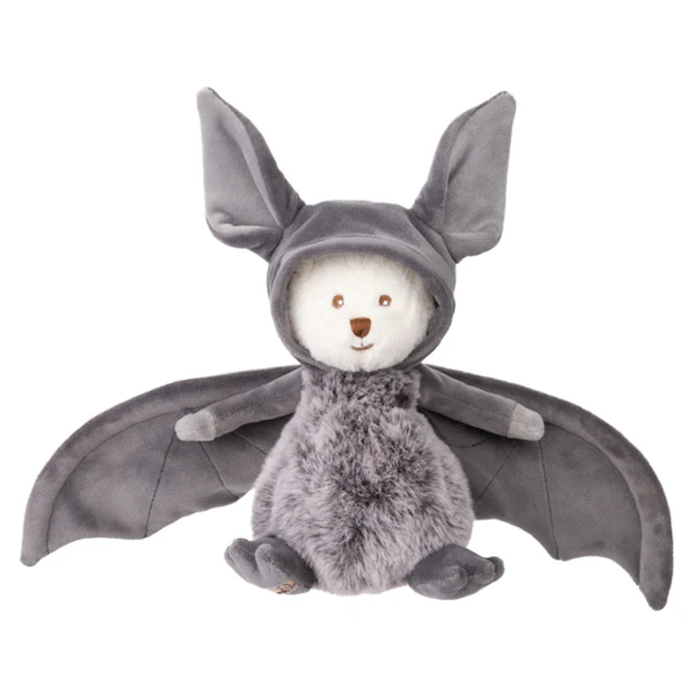 White teddy bear in a gray hood bat outfit with wings  extened on a white background.