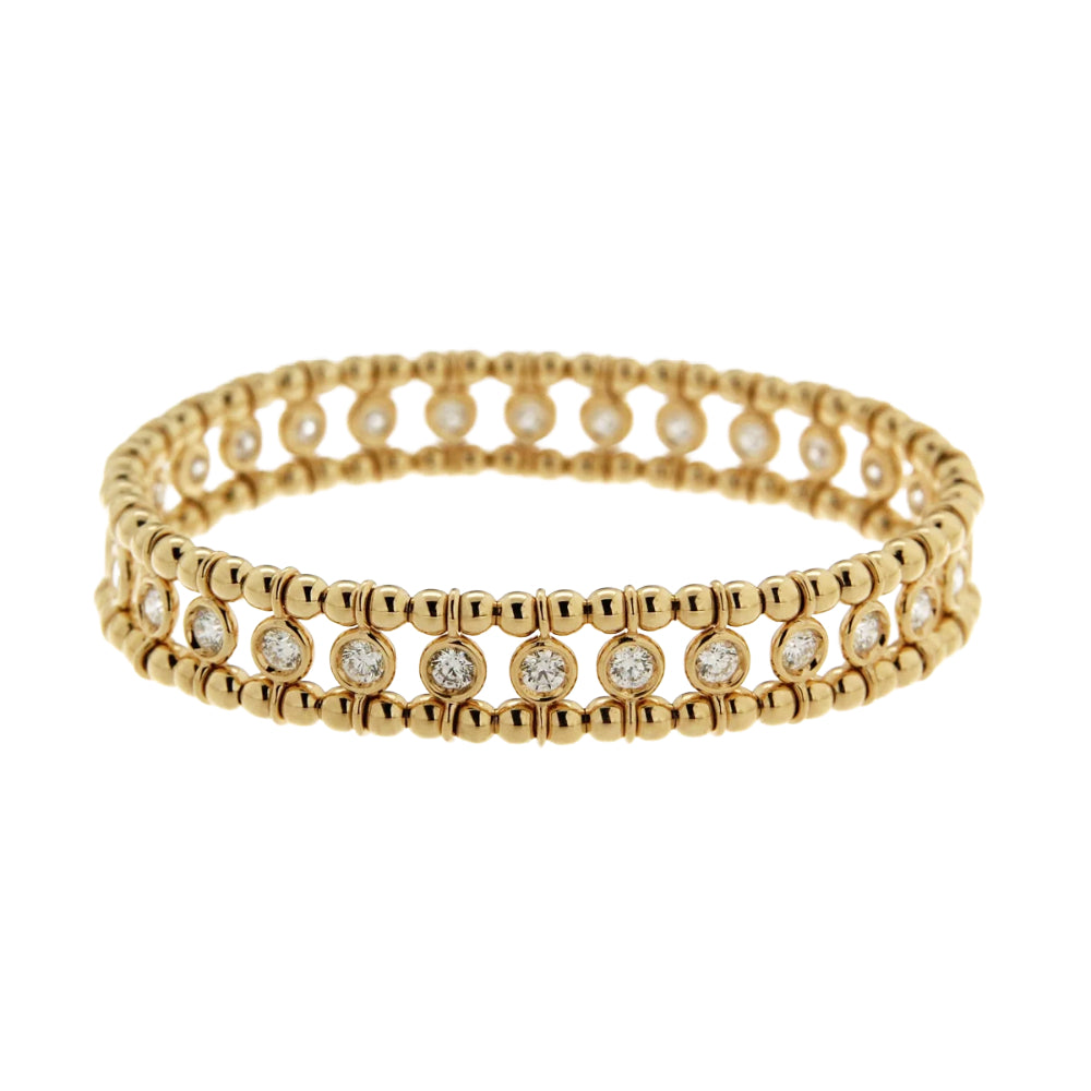 A gold beaded stretch bracelet featuring rows of round clear gemstones, photographed on a clean white background.