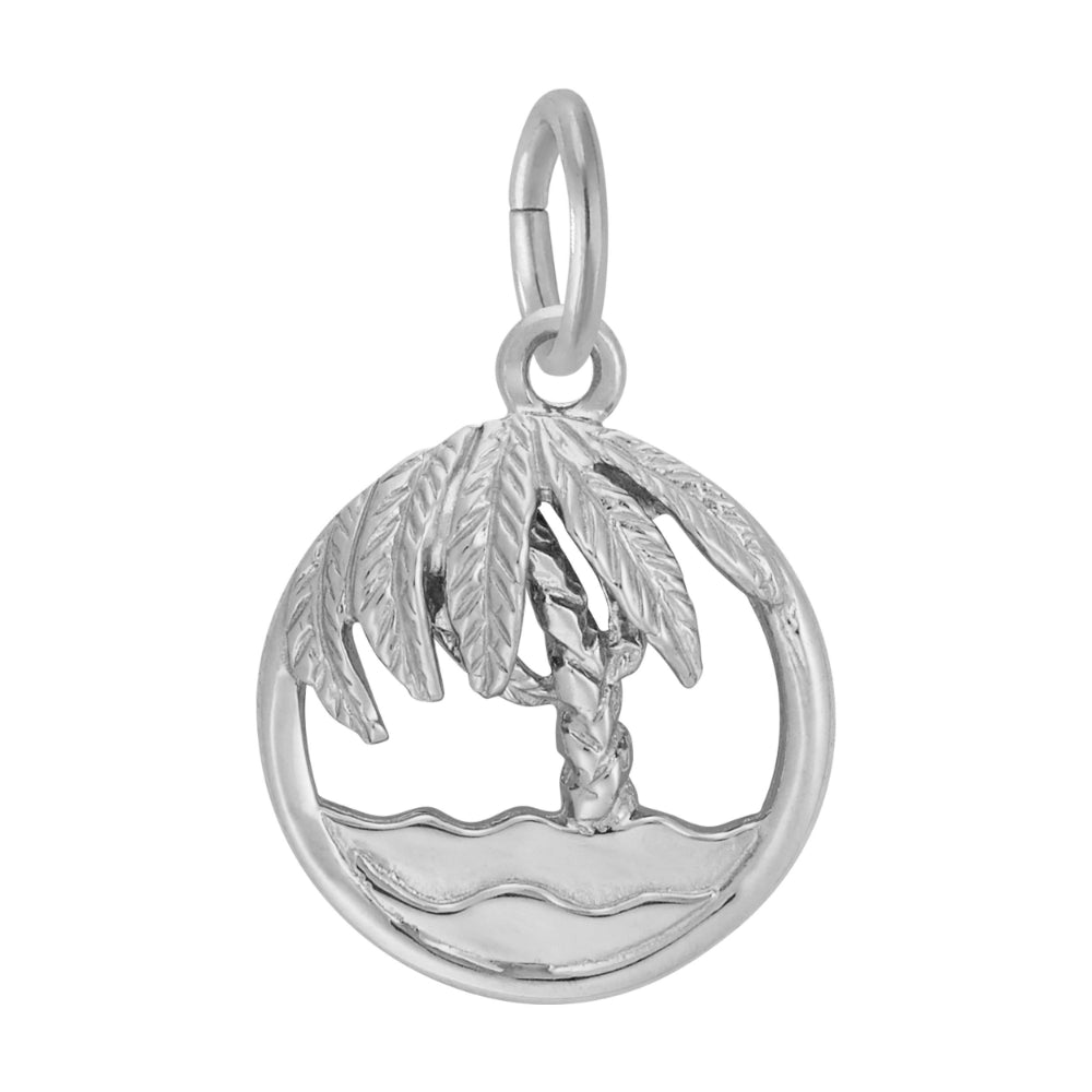 Round silver charm with cutouts ion the middle to from a palm tree and beach, on a white background