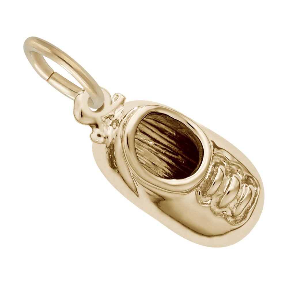 Top down view of Gold Baby Shoe Shaped Charm on a white background