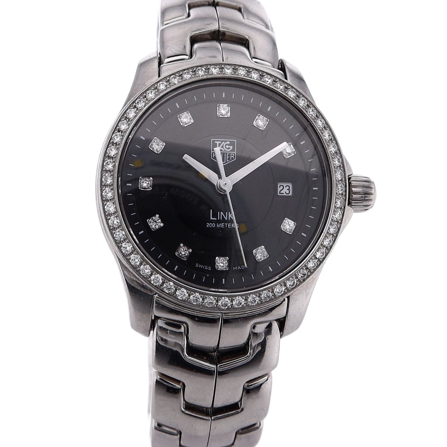 Silver TAG Heuer watch with a black dial, diamond indexes, and diamond bezel on a white background