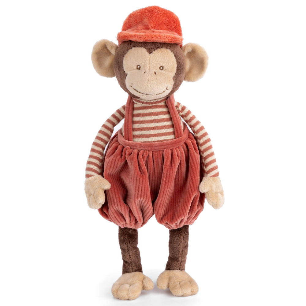 Stuffed monkey toy wearing a red cap, striped shirt, and corduroy pants on a white background.