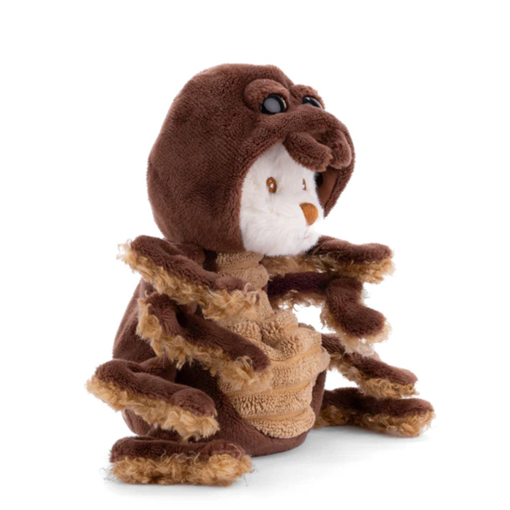 A side photo of a white teddy bear with a brown spider outfit on a white backround. 