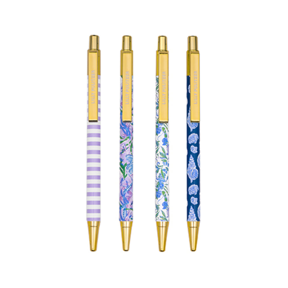 Four gold-accented gel pens with decorative patterned barrels, shown upright on a plain white background. The barrels feature lavender-and-white stripes, purple floral artwork, blue-and-white floral artwork, and a navy blue seashell pattern.
