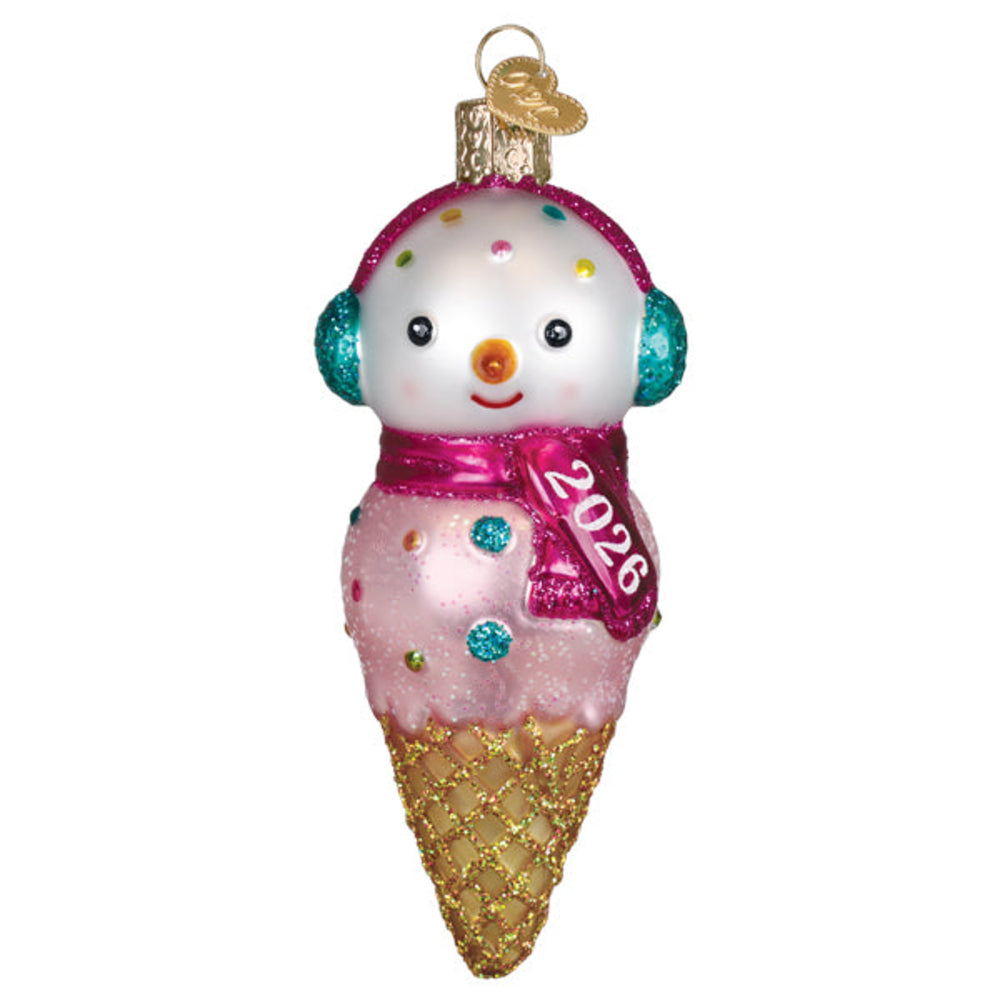 Ice cream cone-shaped ornament with a face, pink scarf, and '2026' on a white background