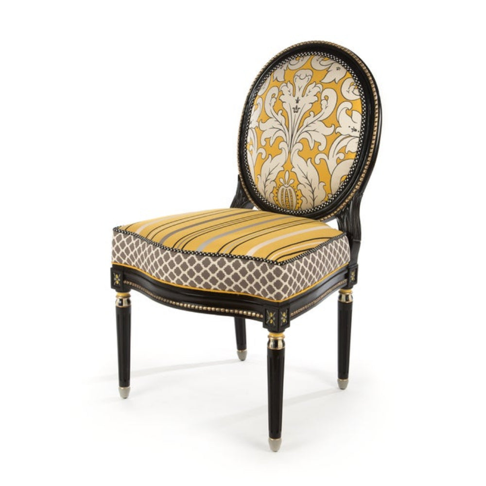 Decorative chair with yellow and black patterned design on a white background
