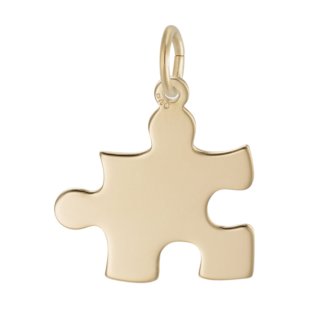 Back of Gold puzzle piece pendant on a white background