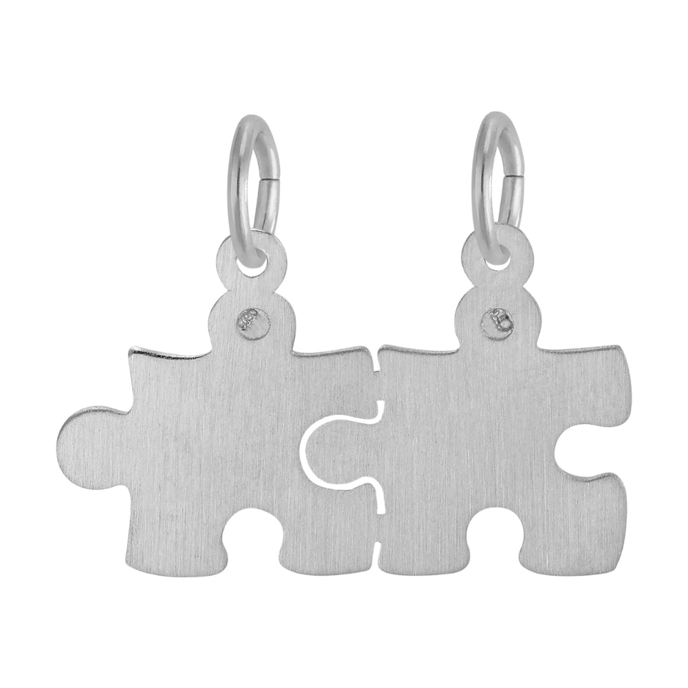 Plain Silver break apart puzzle piece charm on a white background