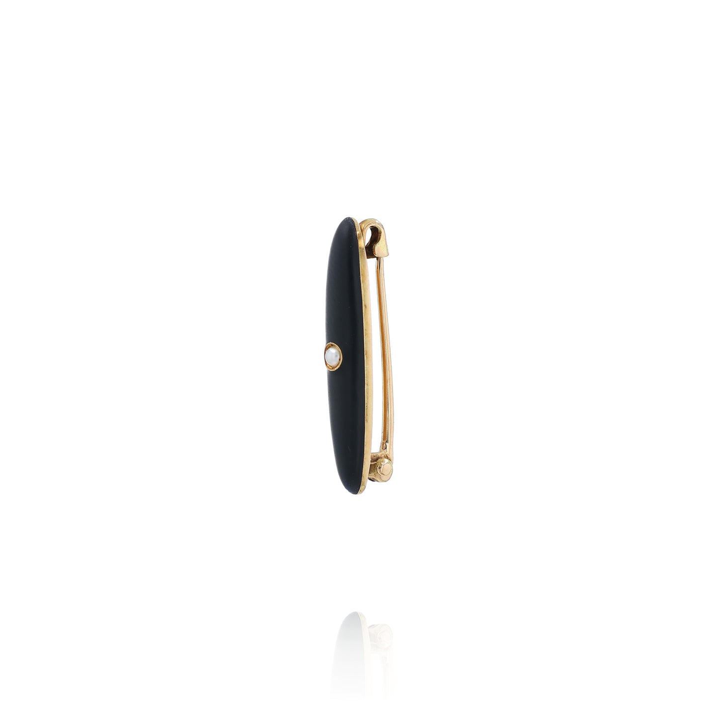 Yellow gold and black enamel pin with a pearl center on a white background