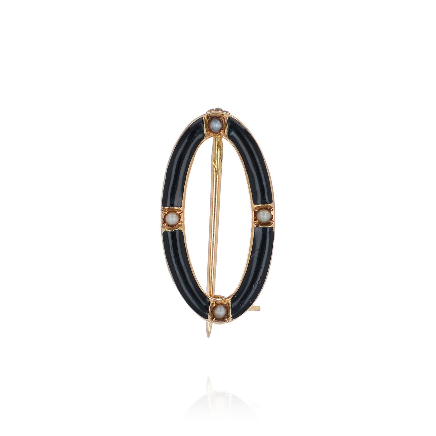 A yellow gold and black enamel open oval seed pearl pin on a white background
