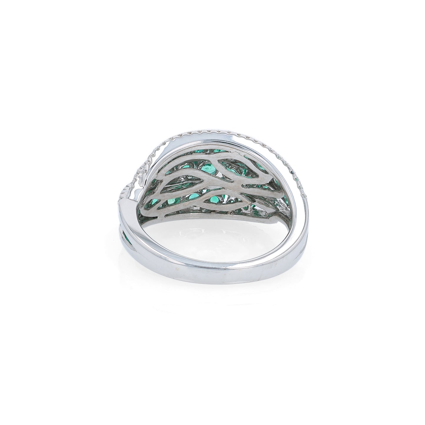 White gold multi-row graduated emerald and diamond ring on a white background