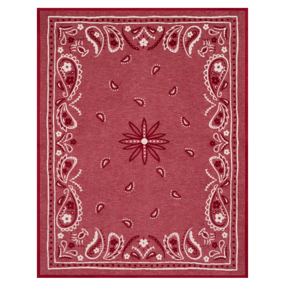 Red bandana patterned blanket with a central star design on a white background