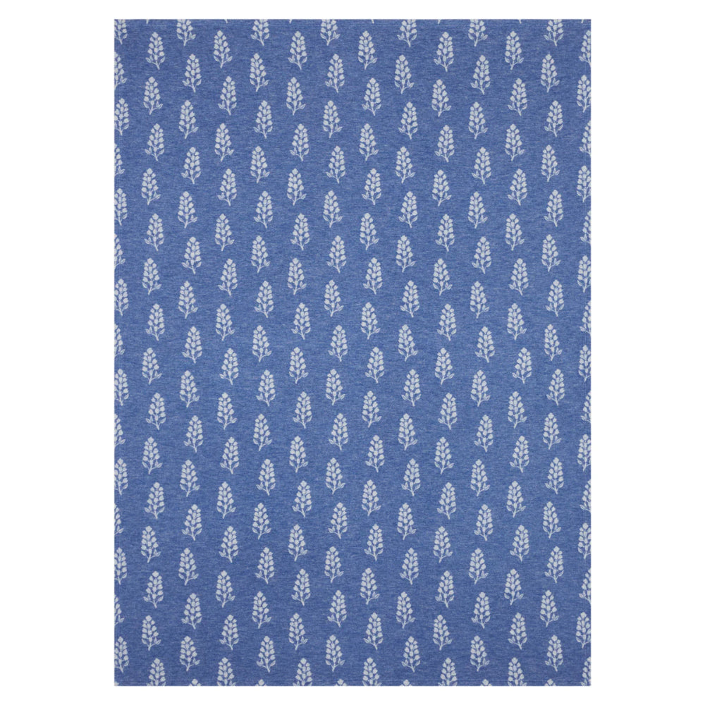 A blue lightweight blanket with floral patterns on a white background. 