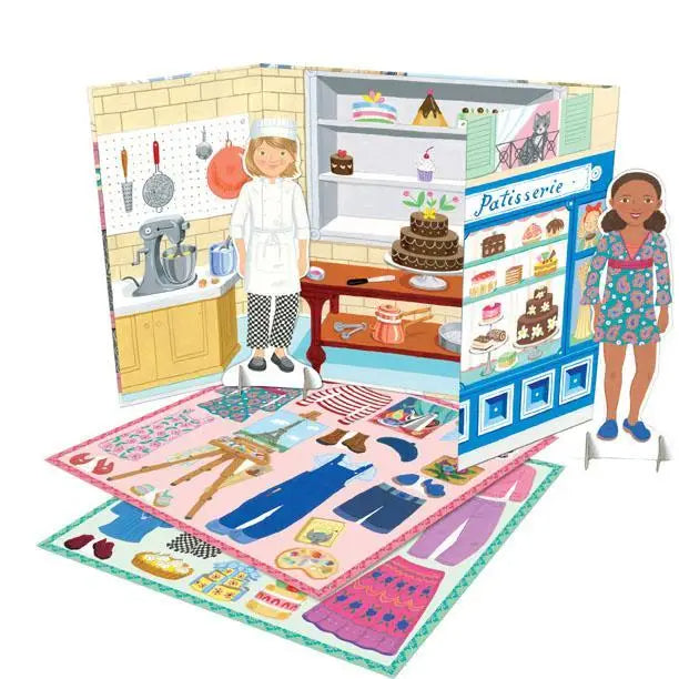 Toy set with a bakery scene, dolls, and a dress-up mat on a white background