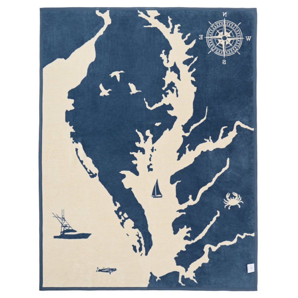 Map design with a compass, boats, and crabs on a blue and beige background