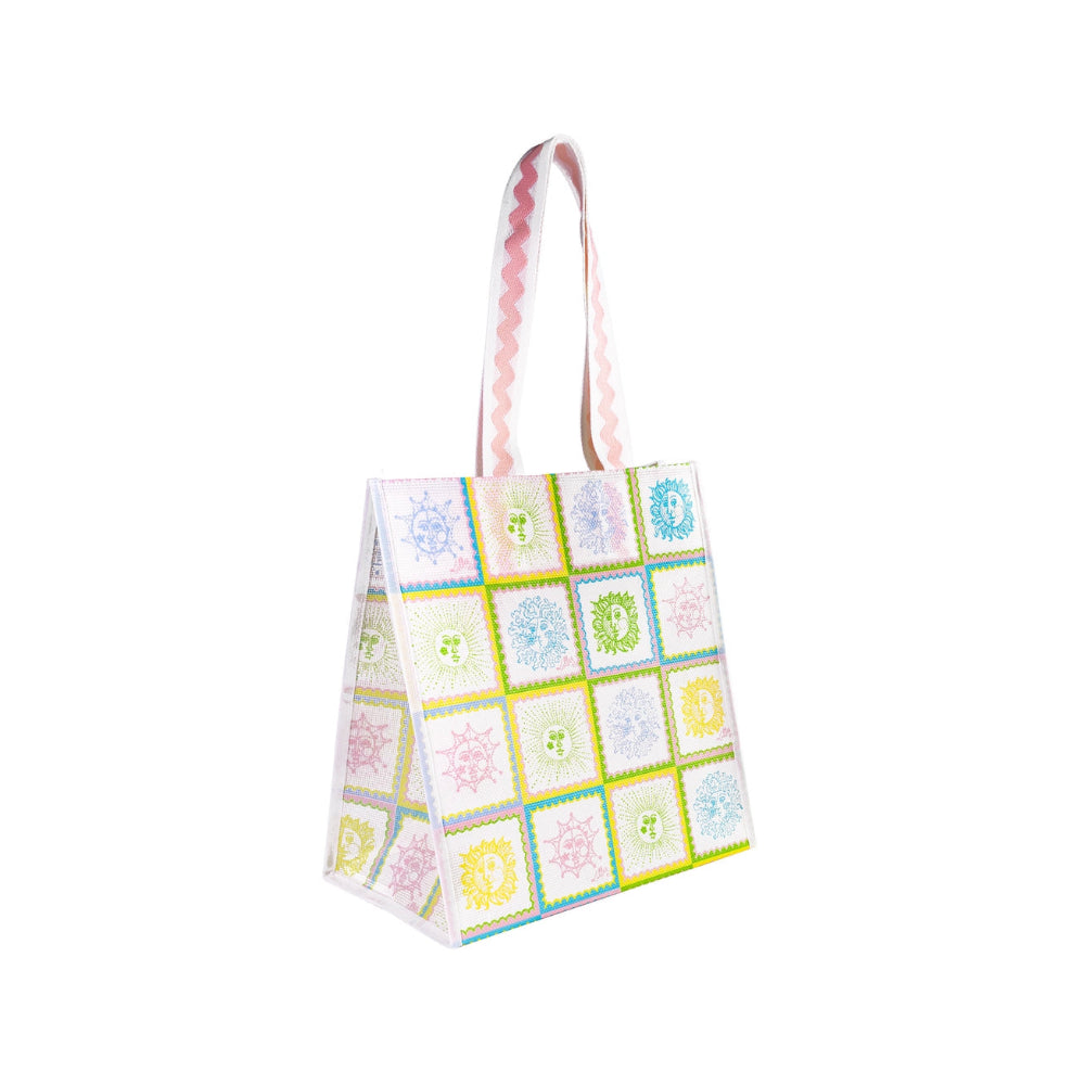 A angled side photo of a tote bag with a colorful pattern on a white background.
