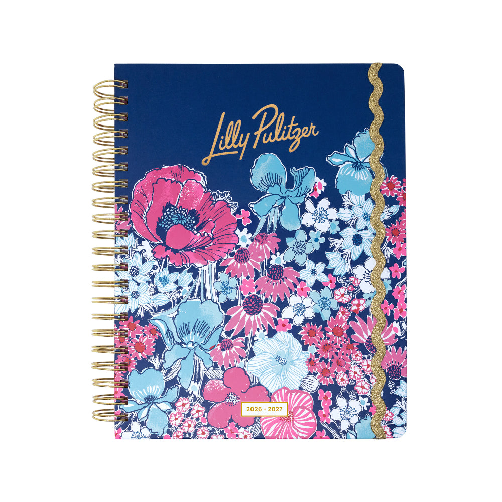 Floral notebook with gold spiral binding on a white background