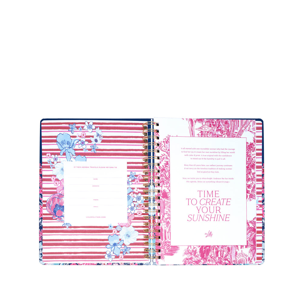 Notebook with floral design and motivational quote on a white background