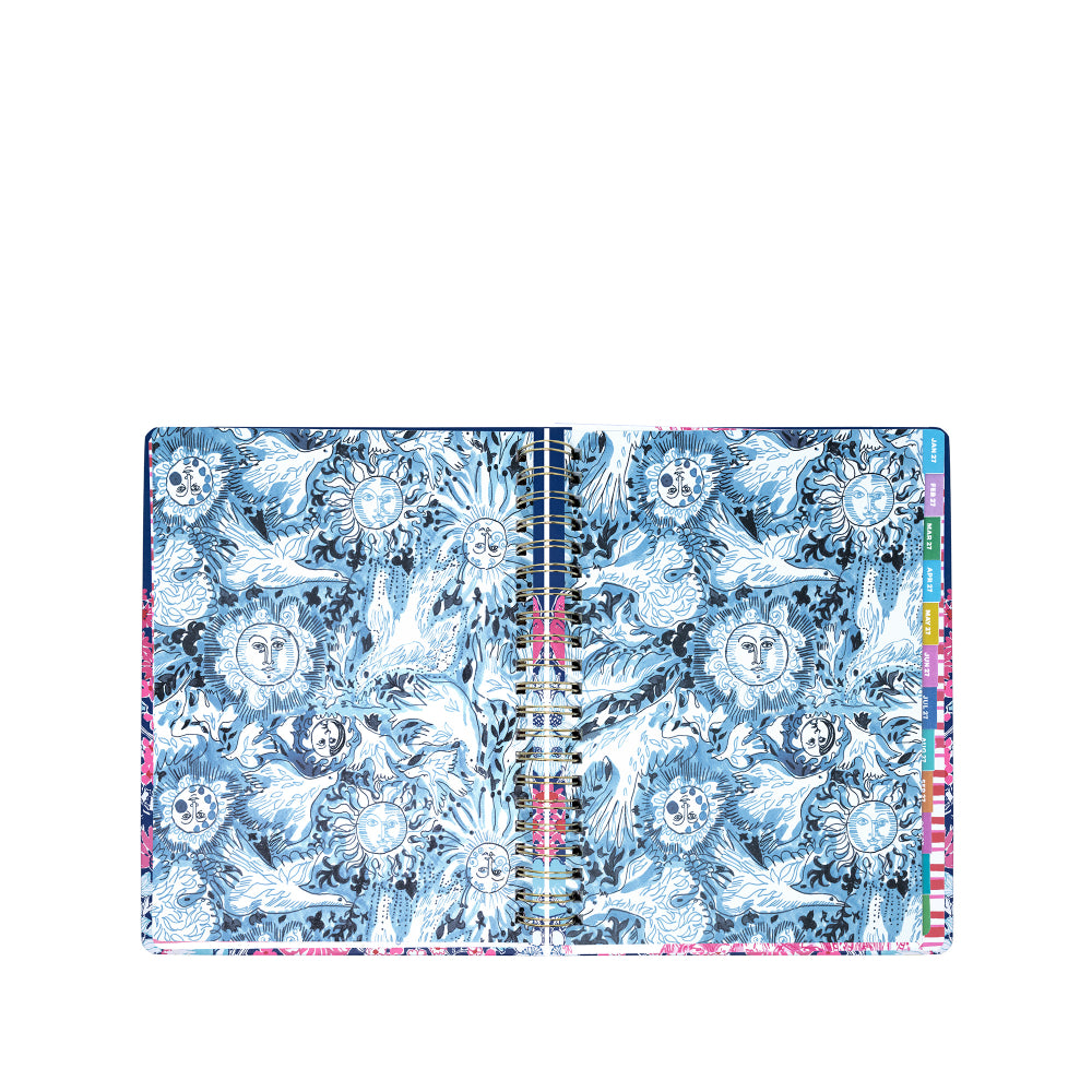 Notebook with blue and white floral pattern on a white background