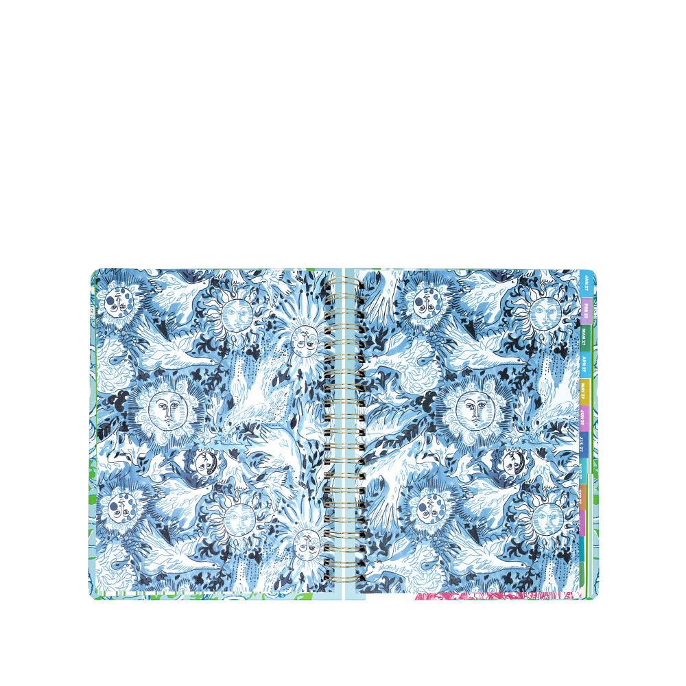 Floral and nature-themed planner with colorful tabs on a white background