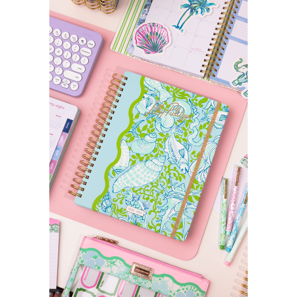Colorful stationery items including notebooks and a pouch on a white background