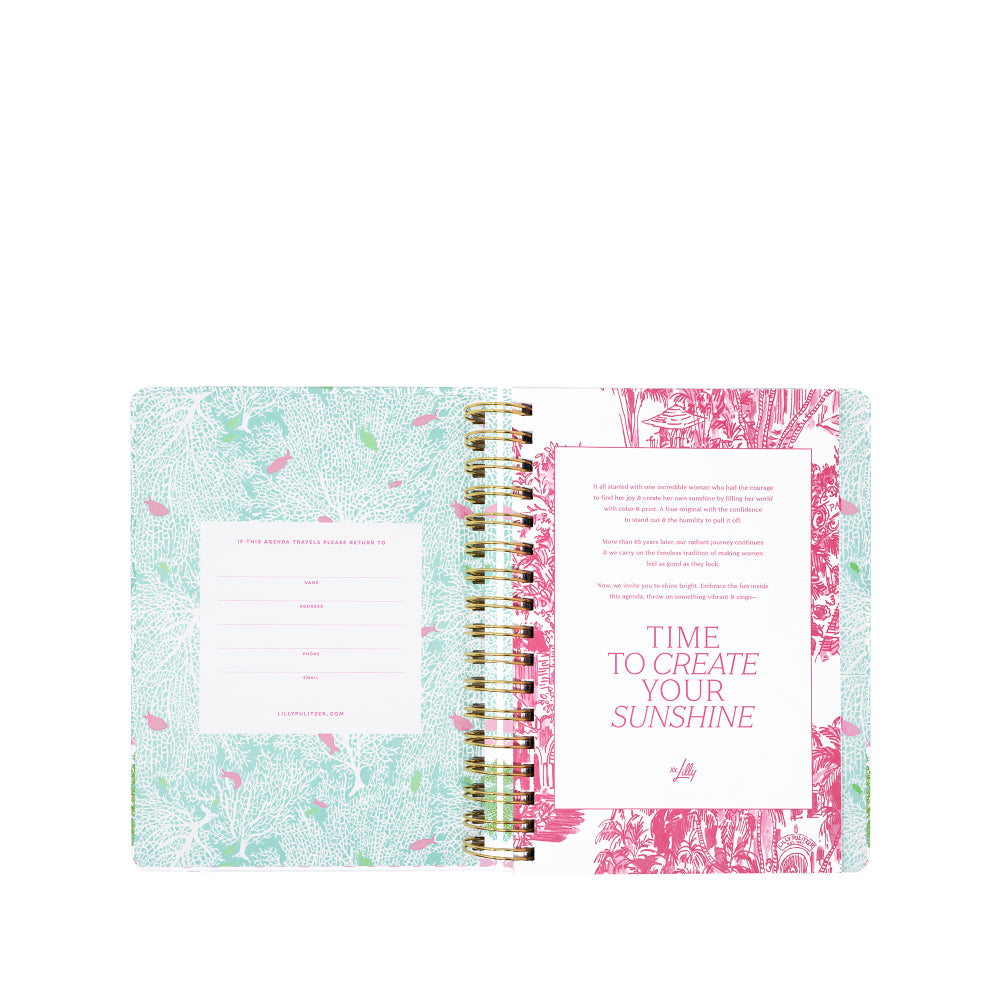 Open planner with floral design on a white background