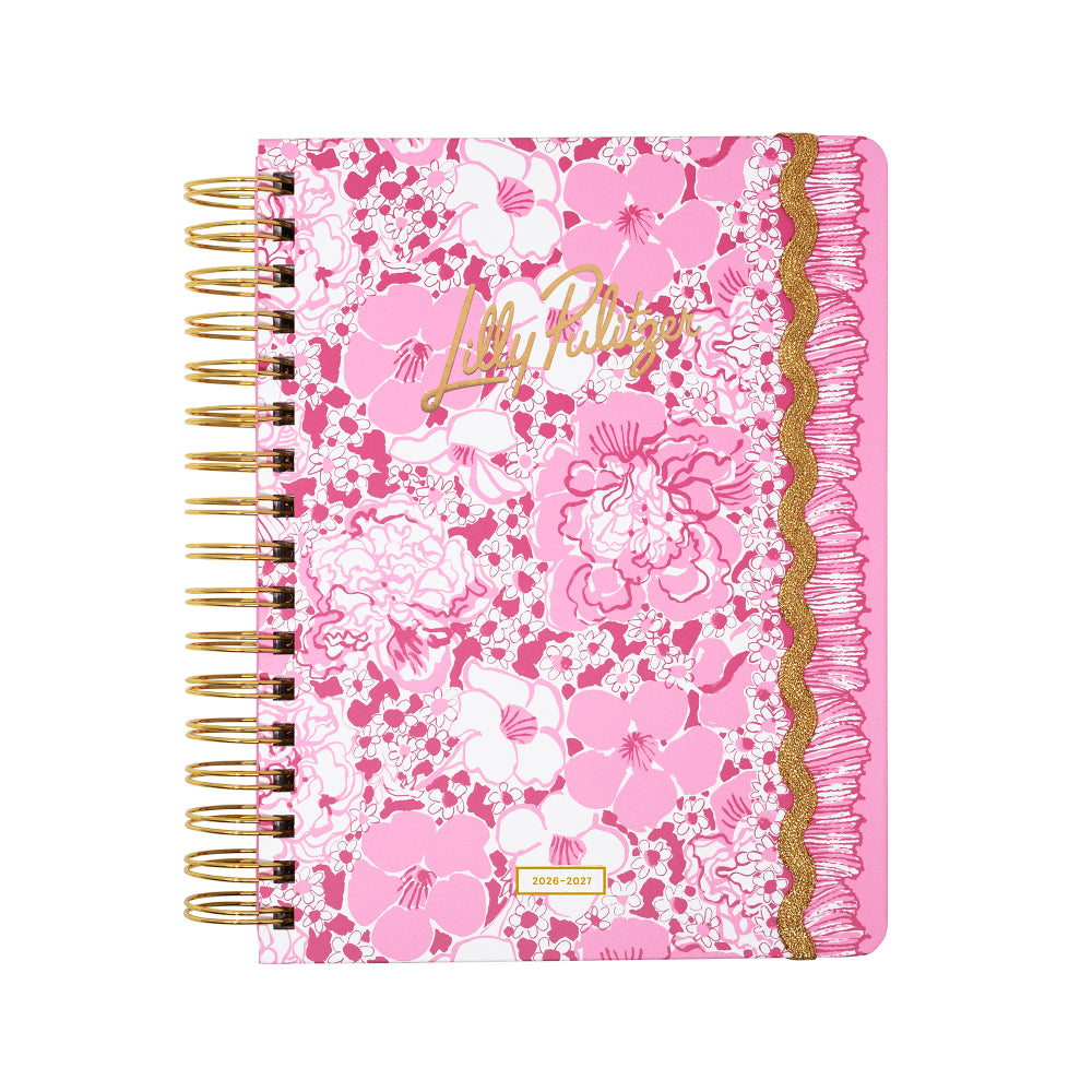Pink floral notebook with gold accents on a white background
