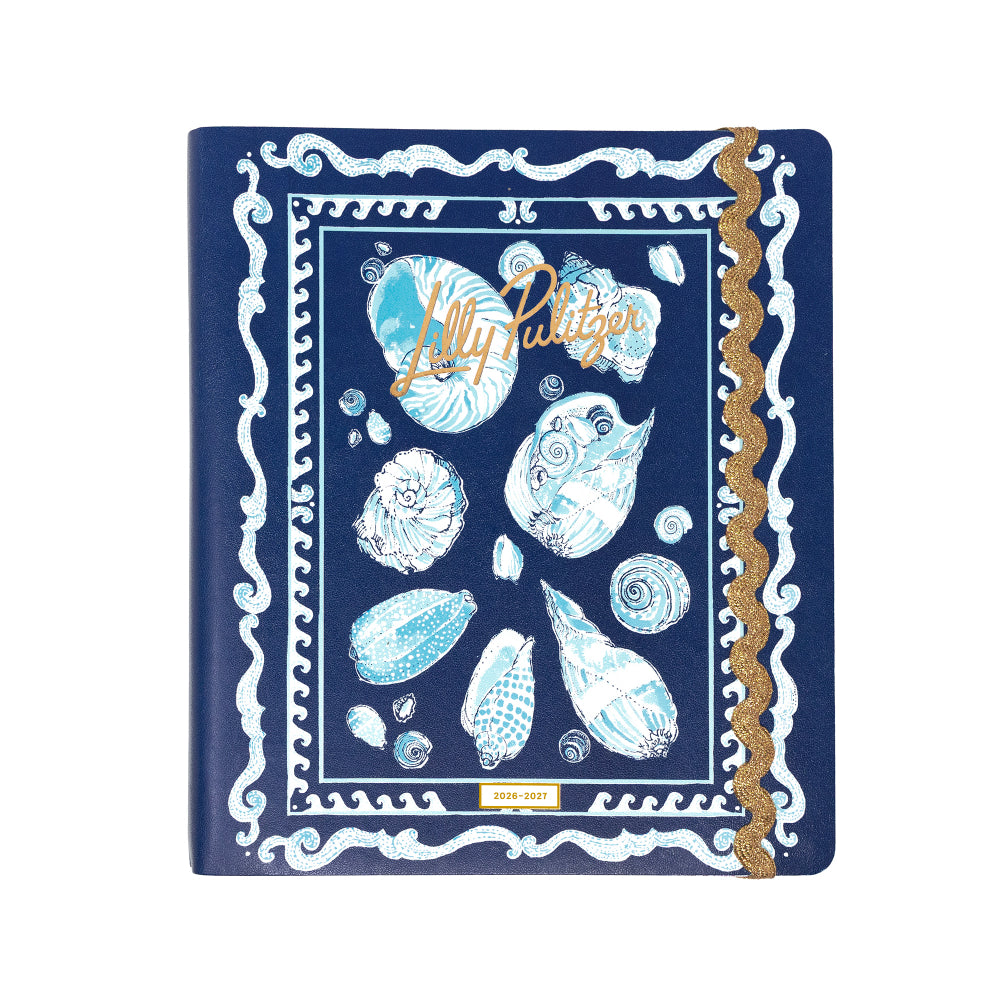 Navy blue agenda with white shell patterns and 'Lilly Pulitzer' branding on a white background
