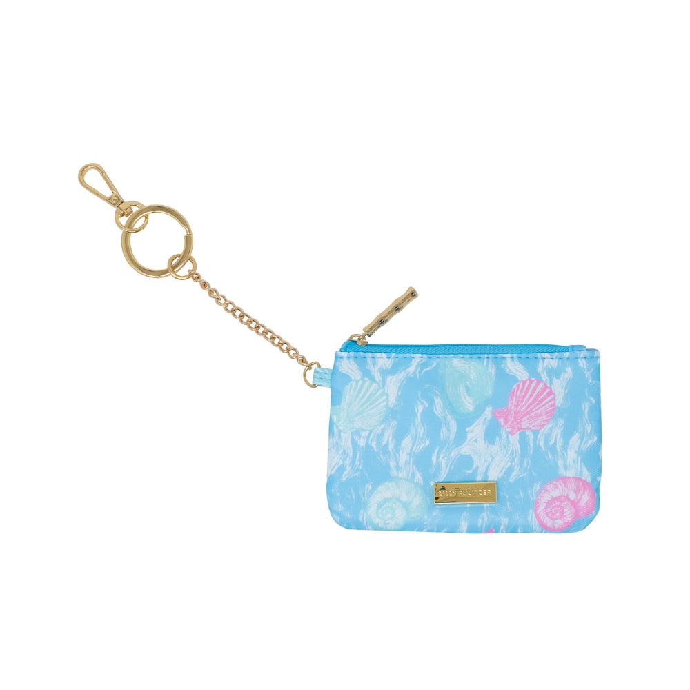 Back of a small blue ID pouch with floral design and gold chain on a marble background.