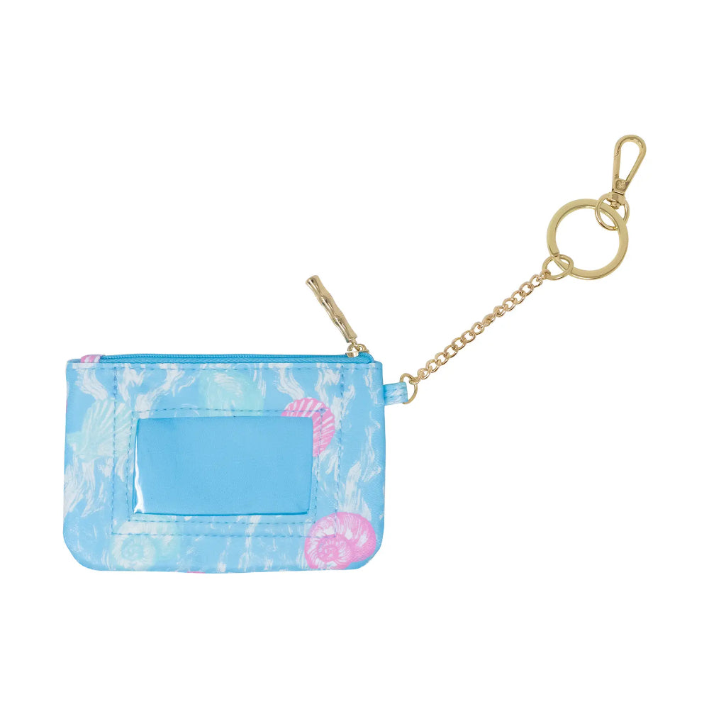 Small blue ID pouch with floral design and gold chain on a marble background.